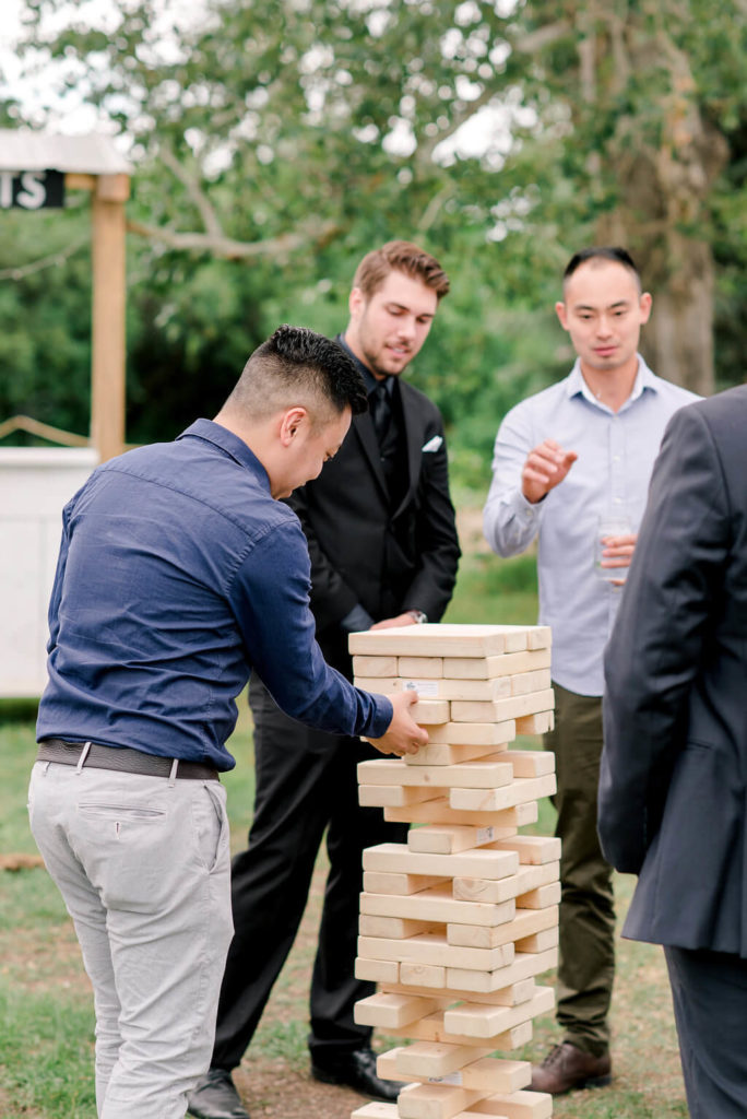 Wedding Jenga a perfect lawn game for an outdoor farm wedding. A great way for guests to mingle and entertain themselves during cocktail hour! https://www.thegathered.ca